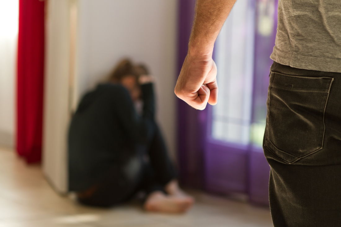 Man beating up his wife illustrating domestic violence